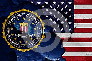 Flag of FBI and USA painted on cracked wall