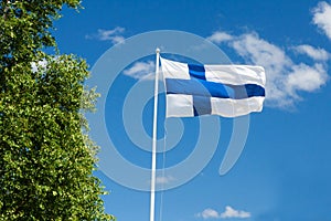 Flag of Finland on sky background.