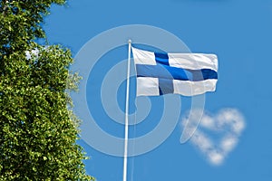 Flag of Finland on sky background.