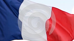 The flag of France waves in the wind in slow motion