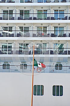 Flag in front of a cruise ship in Costa Maya