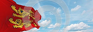 flag of Gallo-Romance peoples Normans at cloudy sky background, panoramic view. flag representing extinct country,ethnic group or