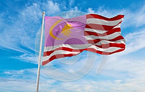 flag of Gay Pride, Malaya waving in the wind at cloudy sky. Free