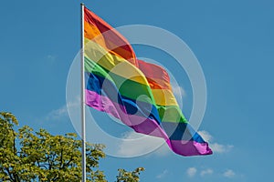 Flag of gay pride movement painted on brick wall