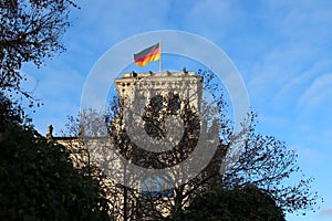 Flag of Germany on top of German Parliamentary Society building in Berlin