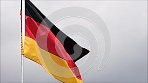 The flag of Germany waves in the wind in slow motion