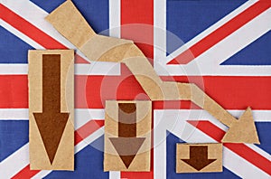 On the flag of Great Britain there are chart figures and an arrow pointing down