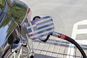 Flag of Greece on the car`s fuel filler flap.