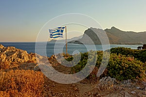 flag on the greece sea coast