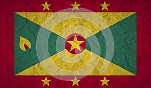 Flag of Grenada with the effect crumpled paper and grunge