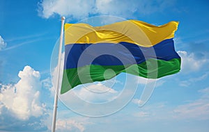 flag of Guainia , Colombia at cloudy sky background on sunset, panoramic view. Colombian travel and patriot concept. copy space photo