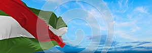 flag of Historic peoples Charrua at cloudy sky background, panoramic view. flag representing ethnic group or culture, regional photo