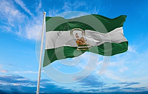 flag of Ibero-Romance peoples Andalusians at cloudy sky background, panoramic view. flag representing ethnic group or culture,