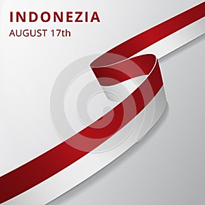 Flag of Indonezia. 17th of August. Vector illustration. Wavy ribbon on gray background. Independence day. National photo