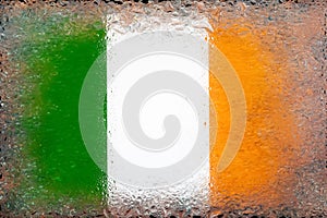 Flag of Ireland. Flag of Ireland on the background of water drops. Flag with raindrops. Splashes on glass