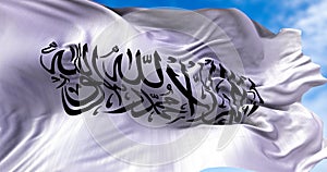 The flag of the Islamic Emirate of Afghanistan waving in the wind