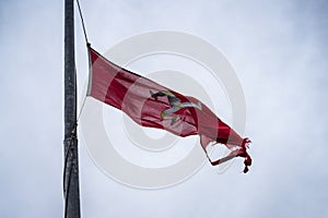 The flag of the Isle of Man or flag of Mann is a triskelion, composed of three armoured legs with golden spurs, upon a red