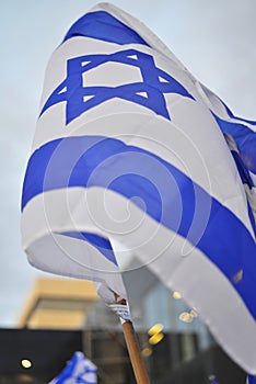 Flag of Israel in Protest demonstration in Haifa