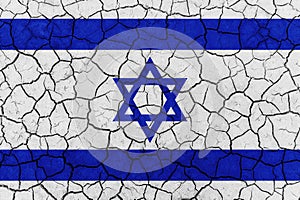 Flag of Israel on the texture of cracked dry earth