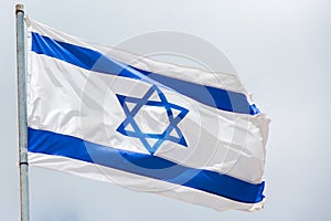 Flag of Israel waving on the wind