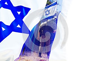 Flag Israel with white background for text, and under the banner an Israeli soldier is visible holding an Israeli flag in his hand