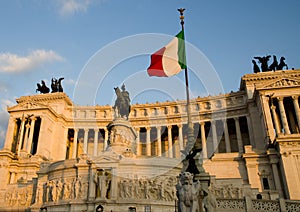 Flag of Italy and Altare del Patria on the background