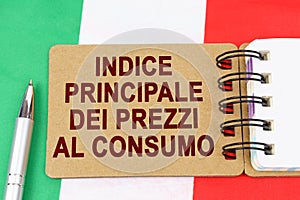 On the flag of Italy lies a pen and a notebook with the inscription - core consumer price index