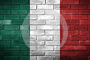 Flag of Italy painted on a brick wall. photo