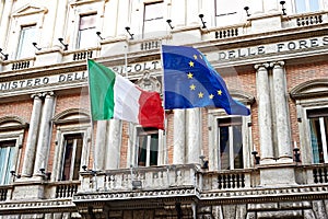 Flag of Italy and United Europe on government in Rome