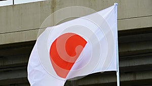 The flag of Japan waves in the wind in slow motion