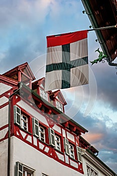 Flag of Konstanz against half-timbered historical house in the center of Konstanz City, Baden-Wurttemberg, Germany