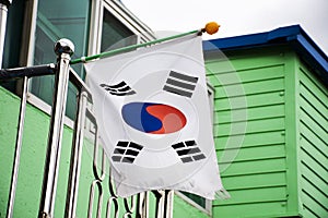 Flag of Korea or korean nation on steel pole at outdoor of house home at Gamcheon Culture Village or Santorini of Pusan city in