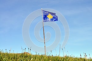 The flag of Kosovo has a blue background, charged with a map of Kosovo and six stars.