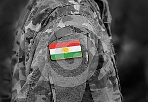 Flag of Kurdistan on soldiers arm. Flag of Kurdistan on military photo