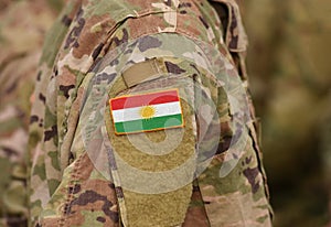 Flag of Kurdistan on soldiers arm. Flag of Kurdistan on military photo