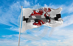 flag of Leverkusen at cloudy sky background on sunset, panoramic view. Federal Republic of Germany. copy space for wide banner