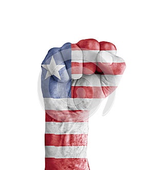 Flag of Liberia painted on human fist like victory symbol