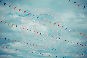 flag line with cloudy sky .