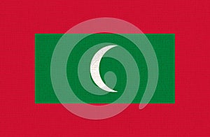 Flag of Maldives. Maldives flag on fabric surface. National symbol