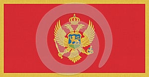 Flag of Montenegro. Montenegrin flag on fabric surface. Balkan country