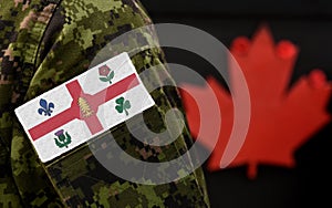 Flag of Montreal on the military uniform and red Maple leaf on the background. Flag of Canadian City of Montreal. Canada Day