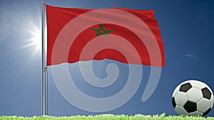 Flag of Morocco fluttering and a football rolls on the lawn, 3d rendering.