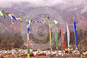 Flag mountain mountain-peak no-people travel symbol buddhism cloud-sky wind red multi-colored environment nature day