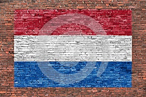 Flag of Netherlands painted over brick wall