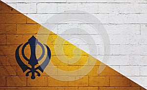 Flag of Nishan Sahib painted on a wall