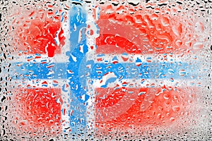 Flag of Norway. Norway flag on the background of water drops. Flag with raindrops. Splashes on glass