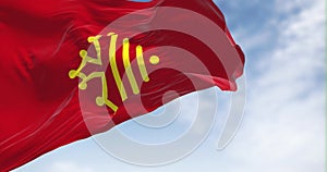 The flag of Occitanie region waving in the wind on a clear day