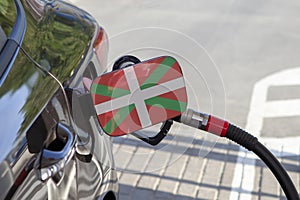 Flag of Pays Basque - Cmjn on the car`s fuel filler flap. photo