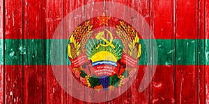 Flag of Pridnestrovian Moldavian Republic on a textured background. Concept collage photo