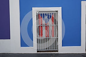 Flag of Puerto Rico behind bars photo